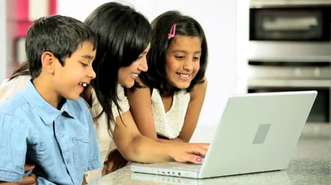 Young Ethnic Mother &amp; Children Using Laptop in Kitchen Stock Footage 8763818