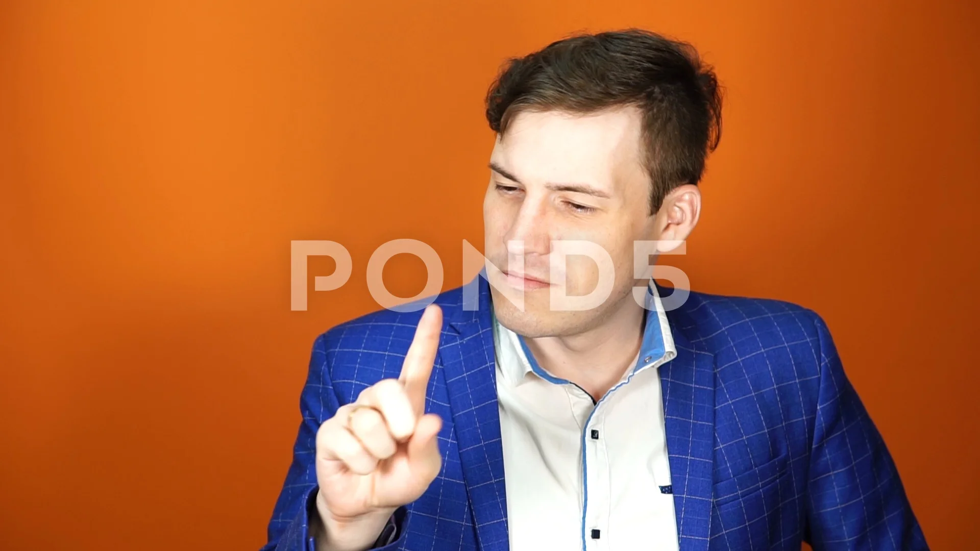 Young man with finger in his nose, picking the nostrils Stock Photo