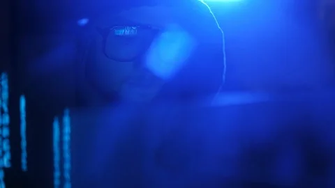 Young evil hacker genius breaking firewall in his underground room. Stock Footage 95261730