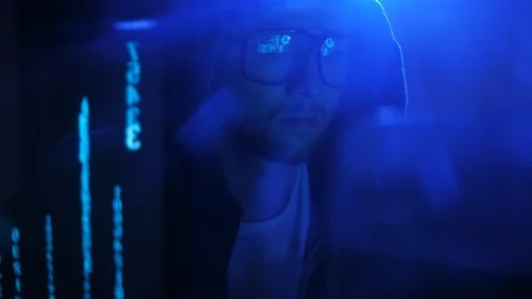 Young evil hacker genius breaking firewall in his underground room. 库存影片 95262060