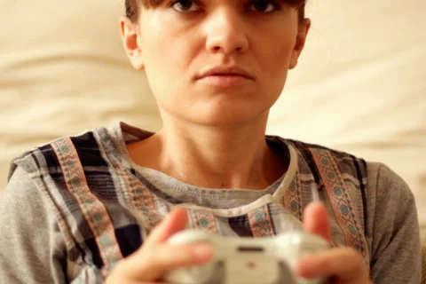 Young exciting woman playing videogames, steadicam shot Stock Footage