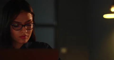 Young executive answering a call while working on the laptop	 Stock Footage 138859771