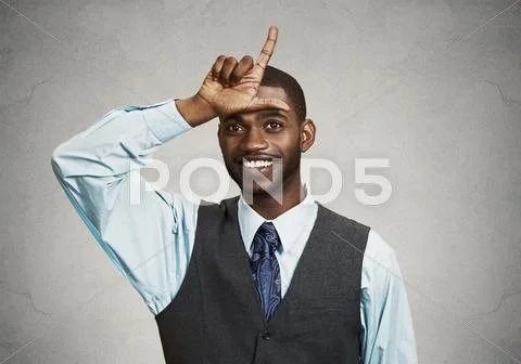 Young executive giving loser sign Stock Photos