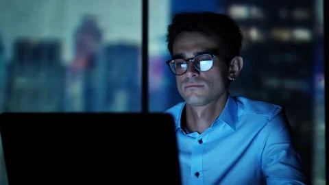 Young Executive Manager Looking at Laptop Screen at Workplace, Working in the Stock Footage 93296798