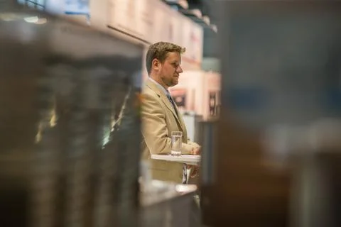 Young executive while attending an event at the convention trade center in Br Stock Photos