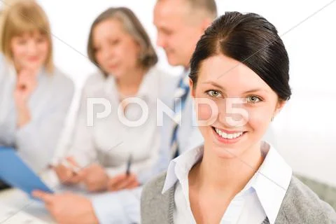 Young executive woman look camera during meeting Stock Photos