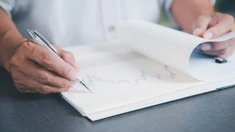 Young executives are signing documents for business contracts. Transaction .. Stock Photos