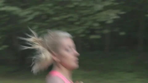 Young exhausted athlete taking a break after a long distance running. Stock Footage 132622101