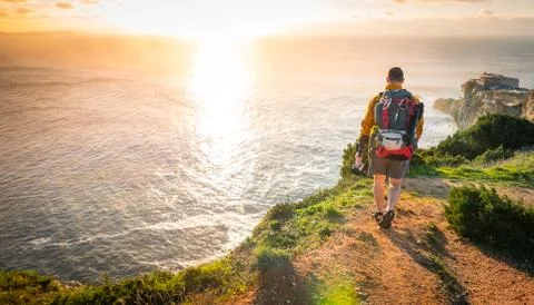 Young Explorer Walking Towards Sunset Stock Photos