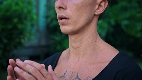 Young Face and Hands of Young Yoga Man Meditating and Breathing in Green Nature Stock Footage 279229979