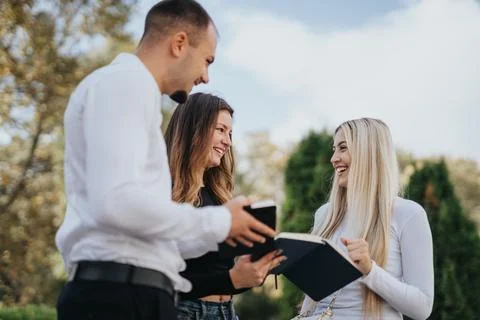 Young, faculty students working as a team, solving tasks, project problems to Stock Photos