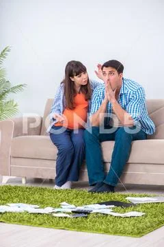 Young family in budget planning concept Stock Photos