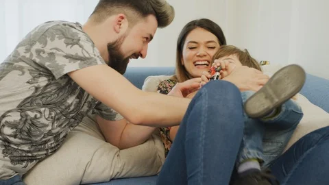Young family with a child having fun Stock Footage 100000028