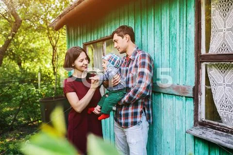 Young family with a child on the nature Stock Photos