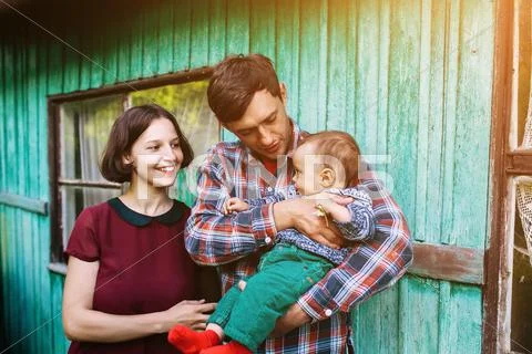 Young family with a child on the nature Stock Photos
