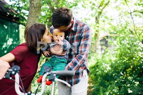 Young family with a child on the nature Stock Photos