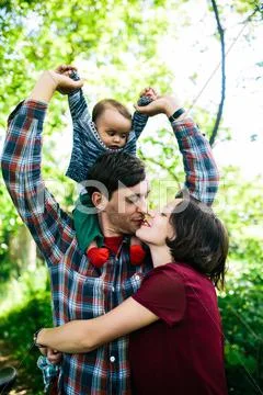 Young family with a child on the nature Stock Photos