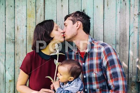 Young family with a child on the nature Stock Photos