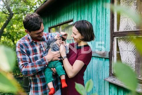 Young family with a child on the nature Stock Photos