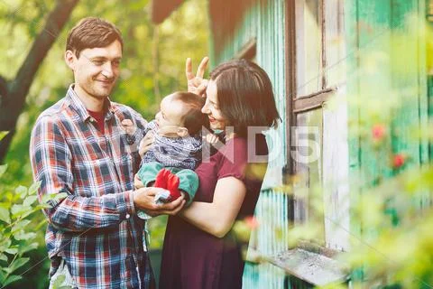 Young family with a child on the nature Stock Photos