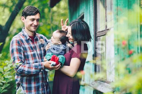 Young family with a child on the nature Stock Photos