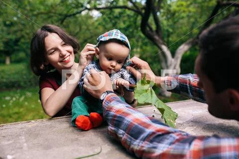 Young family with a child on the nature Stock Photos