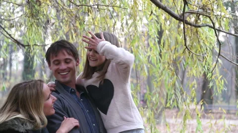 Young family enjoying in park Stock Footage 59554073