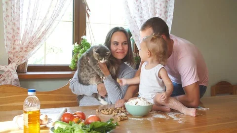 Young family having fun in the kitchen. Video stock 80276454