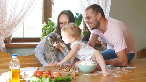 Young family having fun in the kitchen. Video stock 80276824