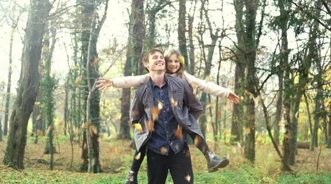 Young family having fun together in the park Stock Footage 59553929