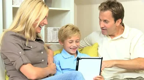 Young Family at Home Using a Wireless Tablet Stock Footage 8986996