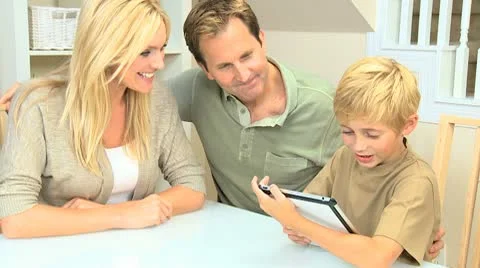 Young Family at Home Using a Wireless Tablet Stock Footage 8987609