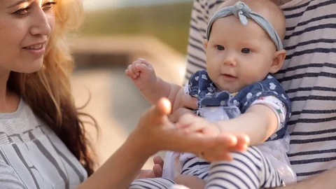 Young family at the Park playing with thair child Stock Footage
