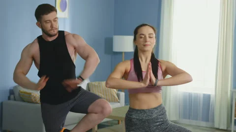 Young Family Practice Basic Yoga and Have Fun at Home 스톡 동영상 132015335