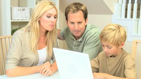 Young Family Using a Laptop Computer Stock Footage 8987601