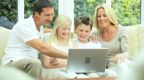 Young Family Using Laptop for Webchat Stock Footage 8825899