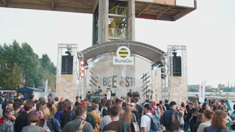 Young fans dance in front of the stage, enjoying music at the Stereoleto Summer Stock Footage 167364561
