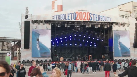 Young fans dance in front of the stage, enjoying music at the Stereoleto Summer Stock Footage 167364675