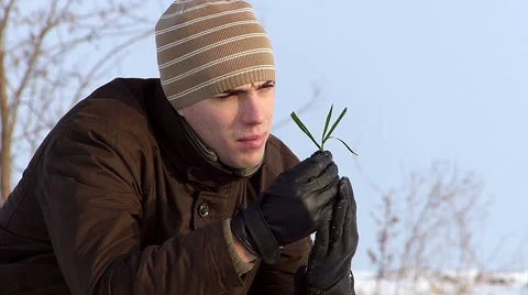 Young farmer checking on wheat in winter Stock Footage 49103814