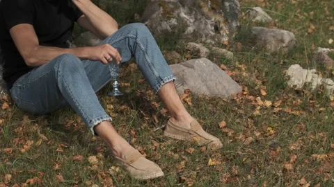 A young farmer sitting by a tree	 Stock Footage 162910215