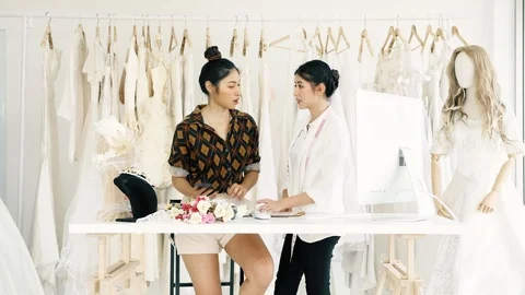 Young fashion house designer working. Talking to customer on phone. Stock Footage 99014341