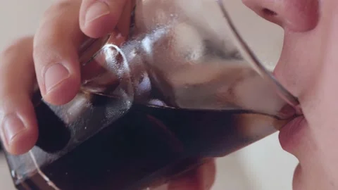 Young fat caucassian man drinks refreshing soda drink Stock Footage 130797509