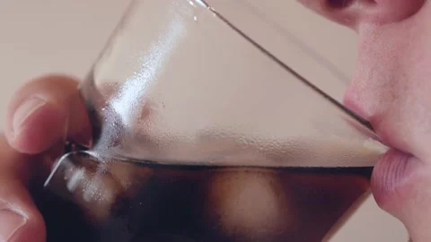 Young fat caucassian man drinks refreshing soda drink Stock Footage 130797684