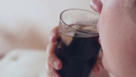 Young fat caucassian man drinks refreshing soda drink Stock Footage 130797696