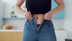 Overweight woman tries to wear pants tha, Stock Video