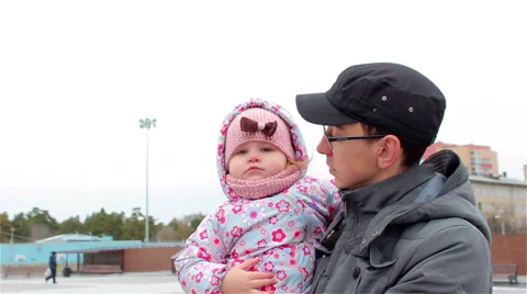 Young father with a small daughter Stock Footage 56526704