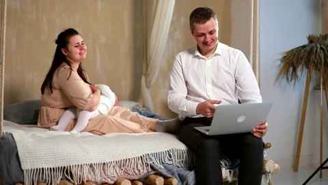 Young father using laptop checking good news with emotional happy face 스톡 동영상 147132765