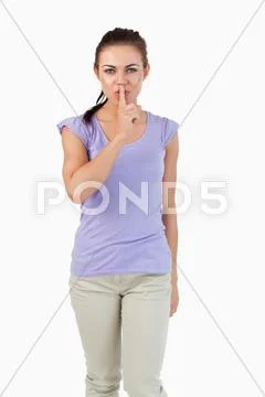 Young female asking for silence Stock Photos