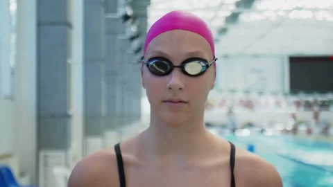 Young female athlete swimmer with goggle... | Stock Video | Pond5