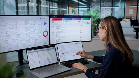Young Female Auditor Using Automated Software Stock Footage 339899525